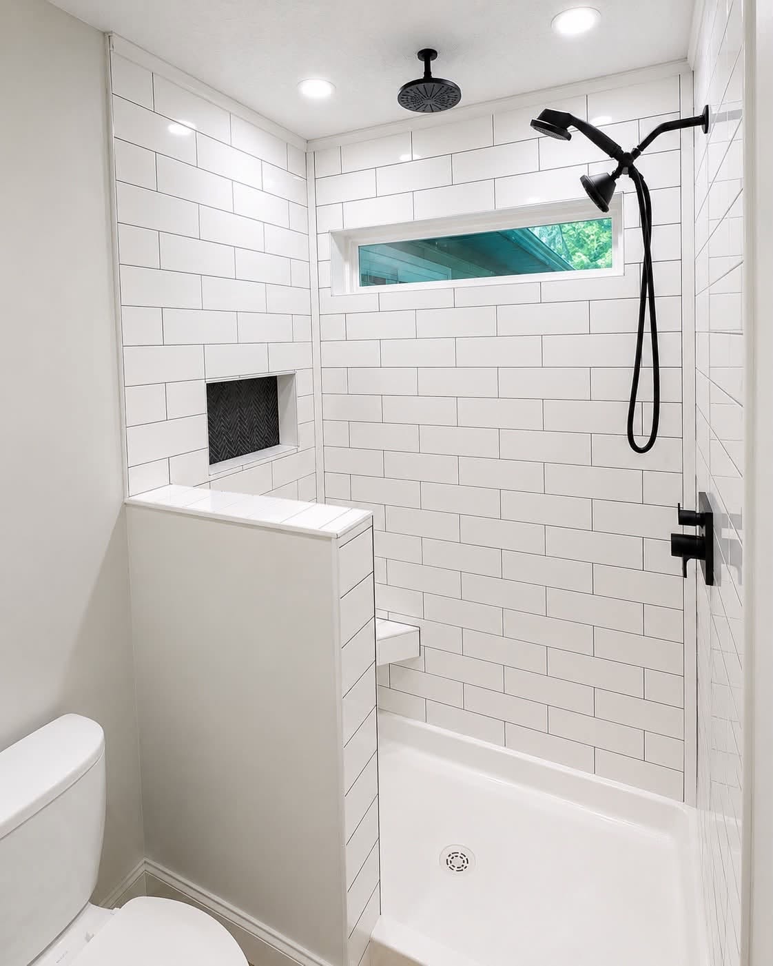 White subway tile shower black fixtures Davenport IA
