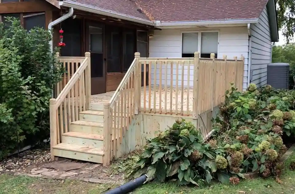 wood entry deck with stairs at a Davenport home