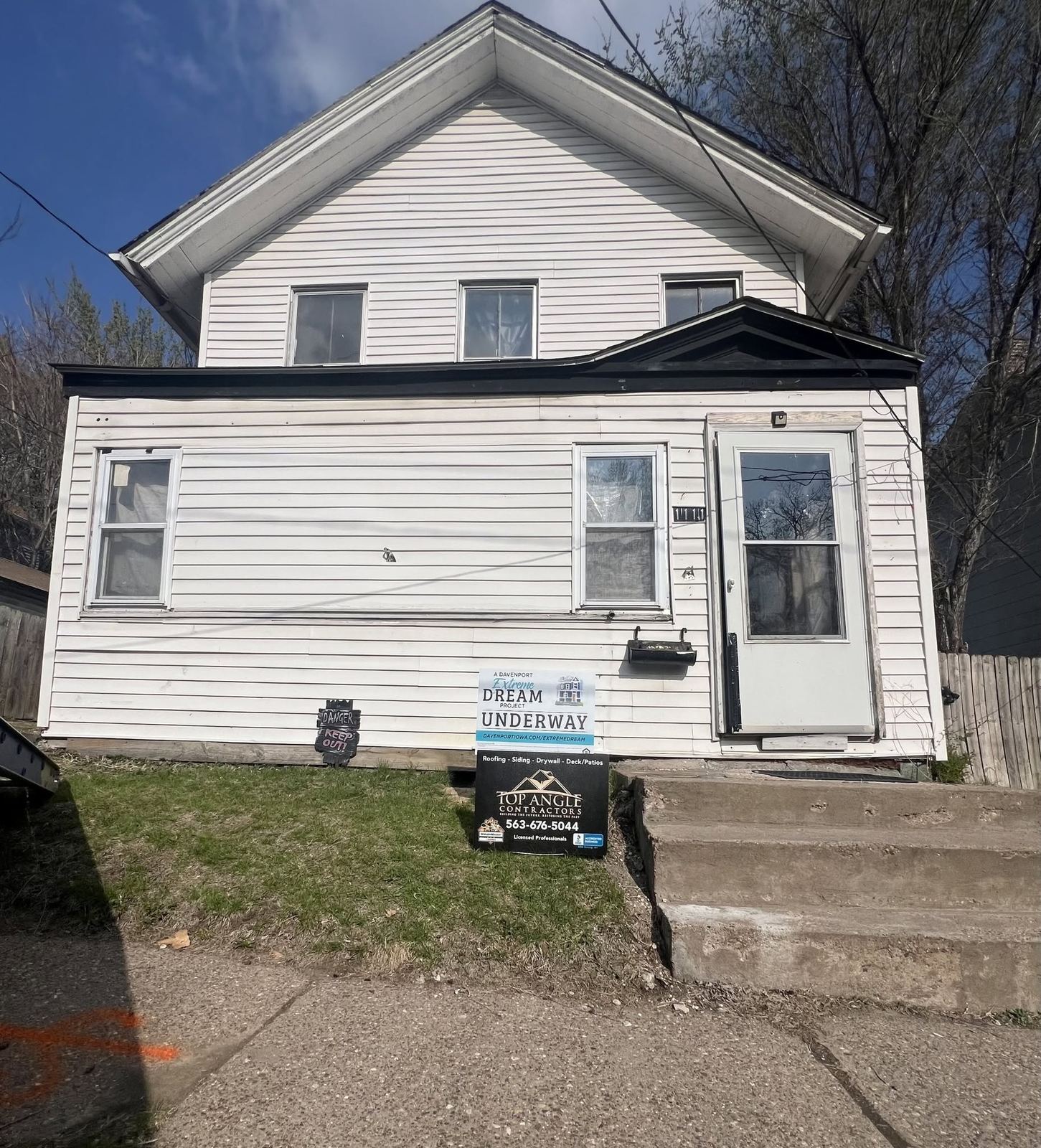 White two-story home front exterior in Davenport, Iowa
