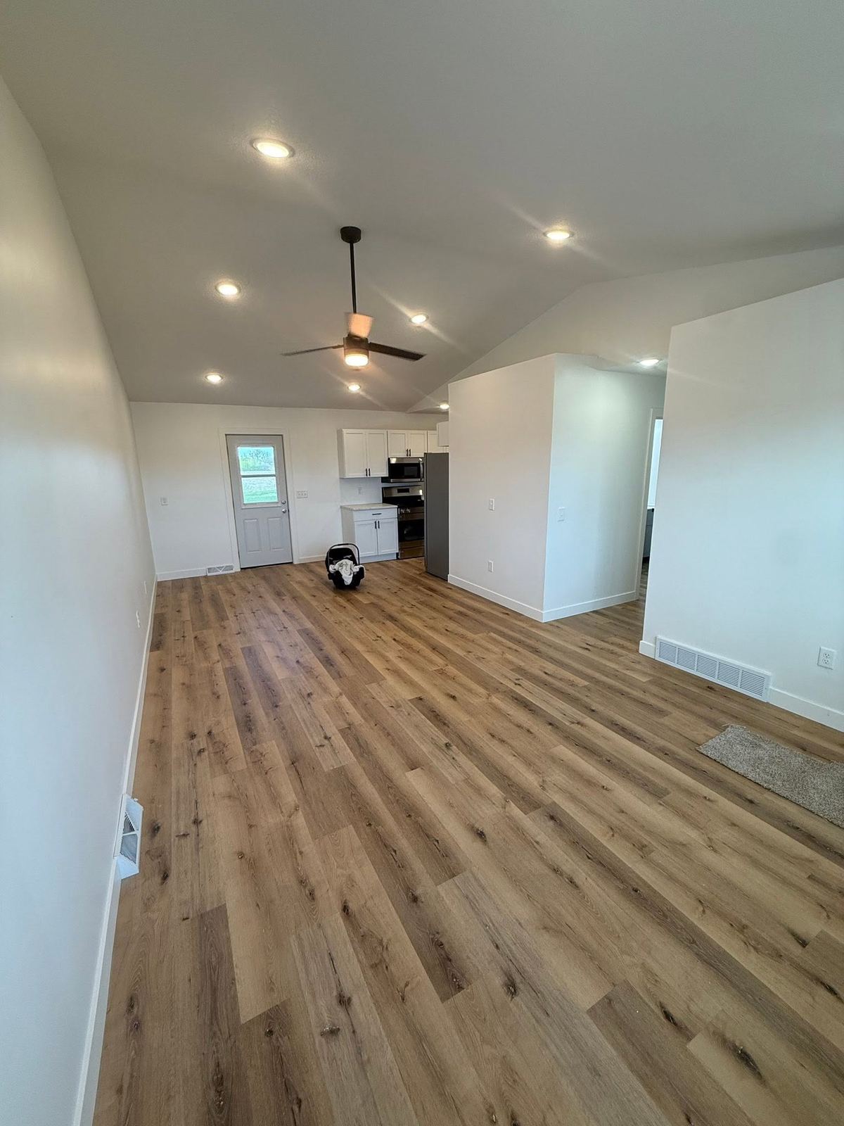 Open plan room new wood floor Davenport IA