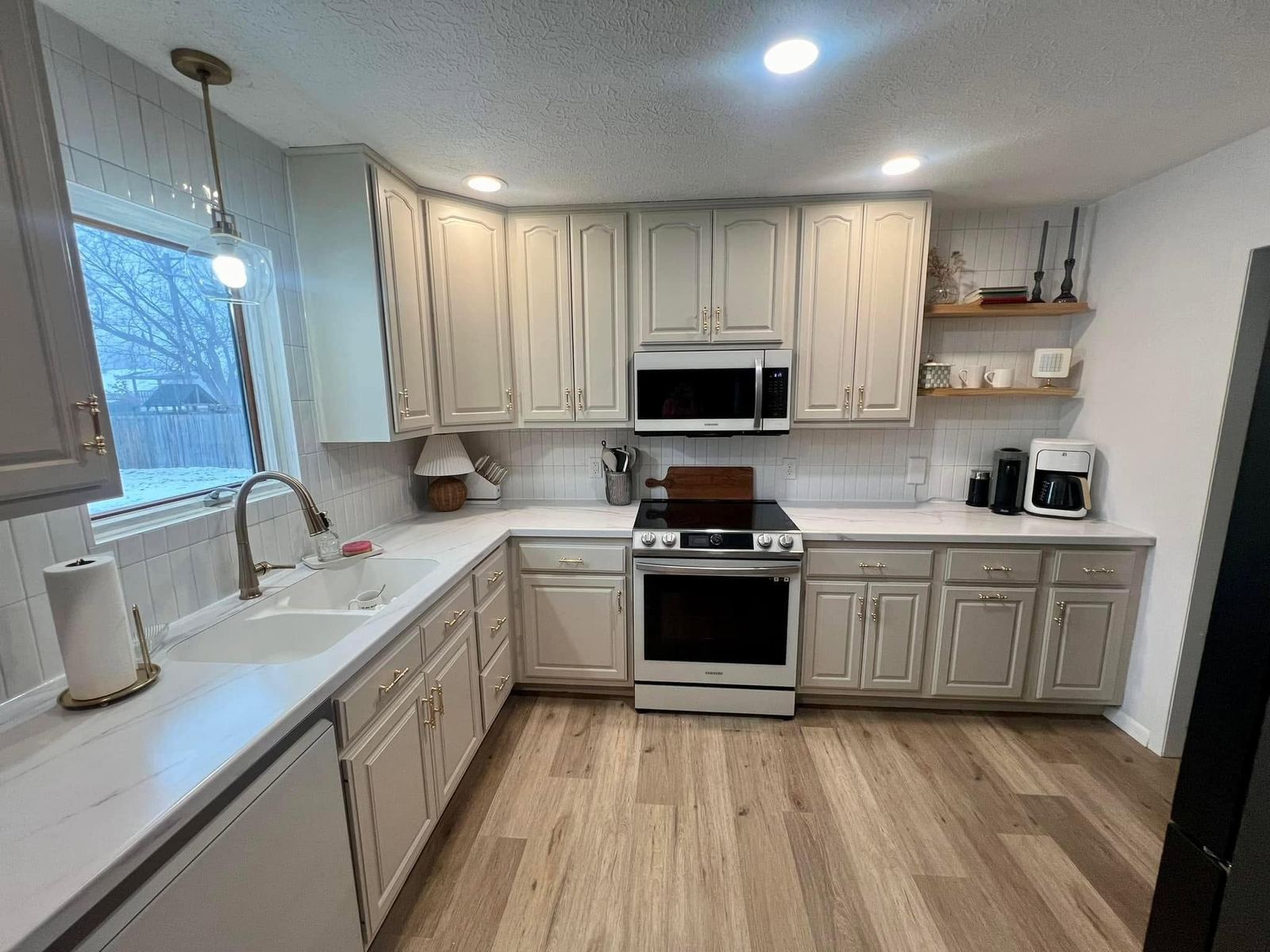 White kitchen black backsplash Davenport IA