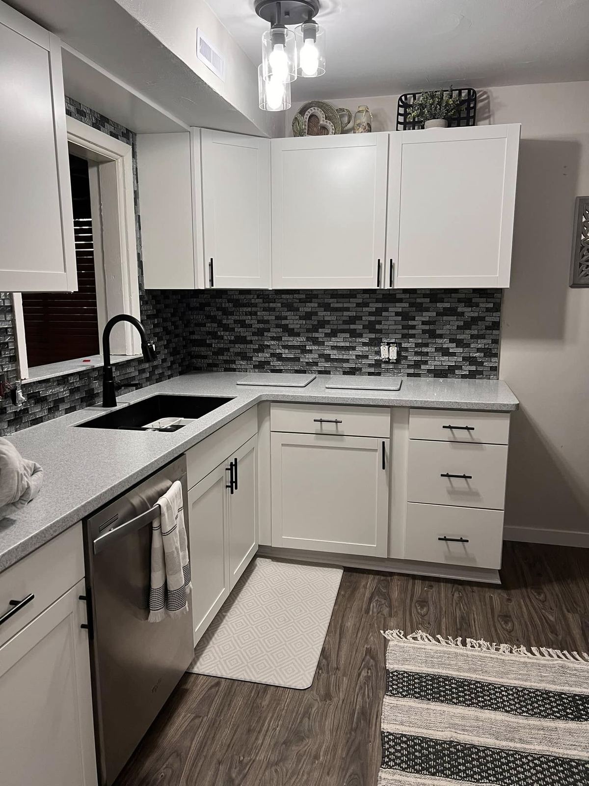 White corner kitchen black backsplash Davenport IA