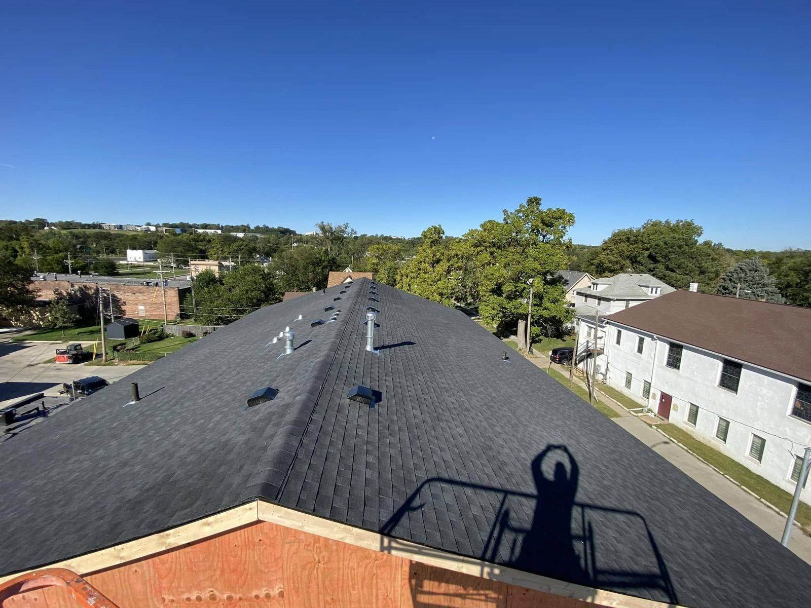 Black shingle roof installation in progress