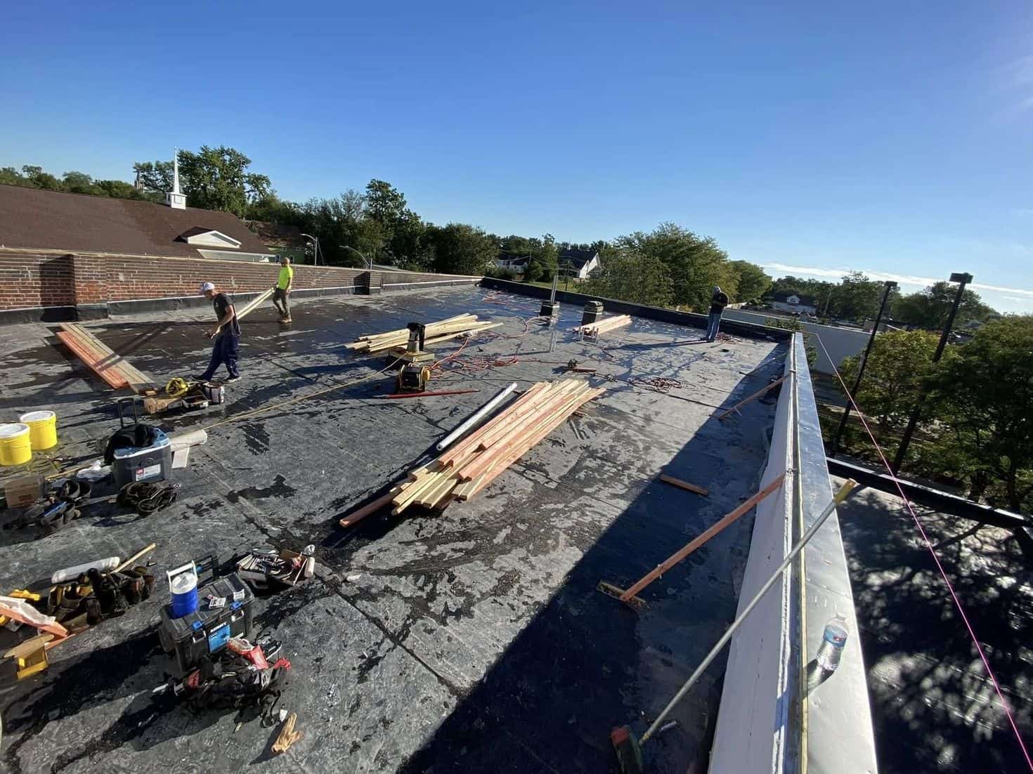 Roofing crew installing shingles Davenport IA