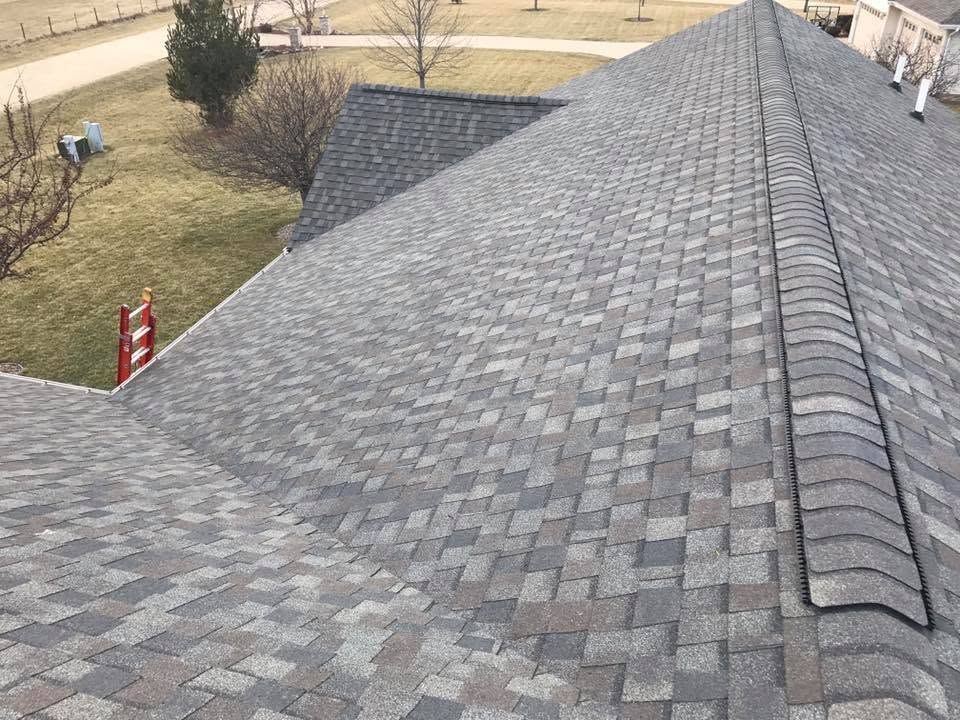 Gray shingle roof installation