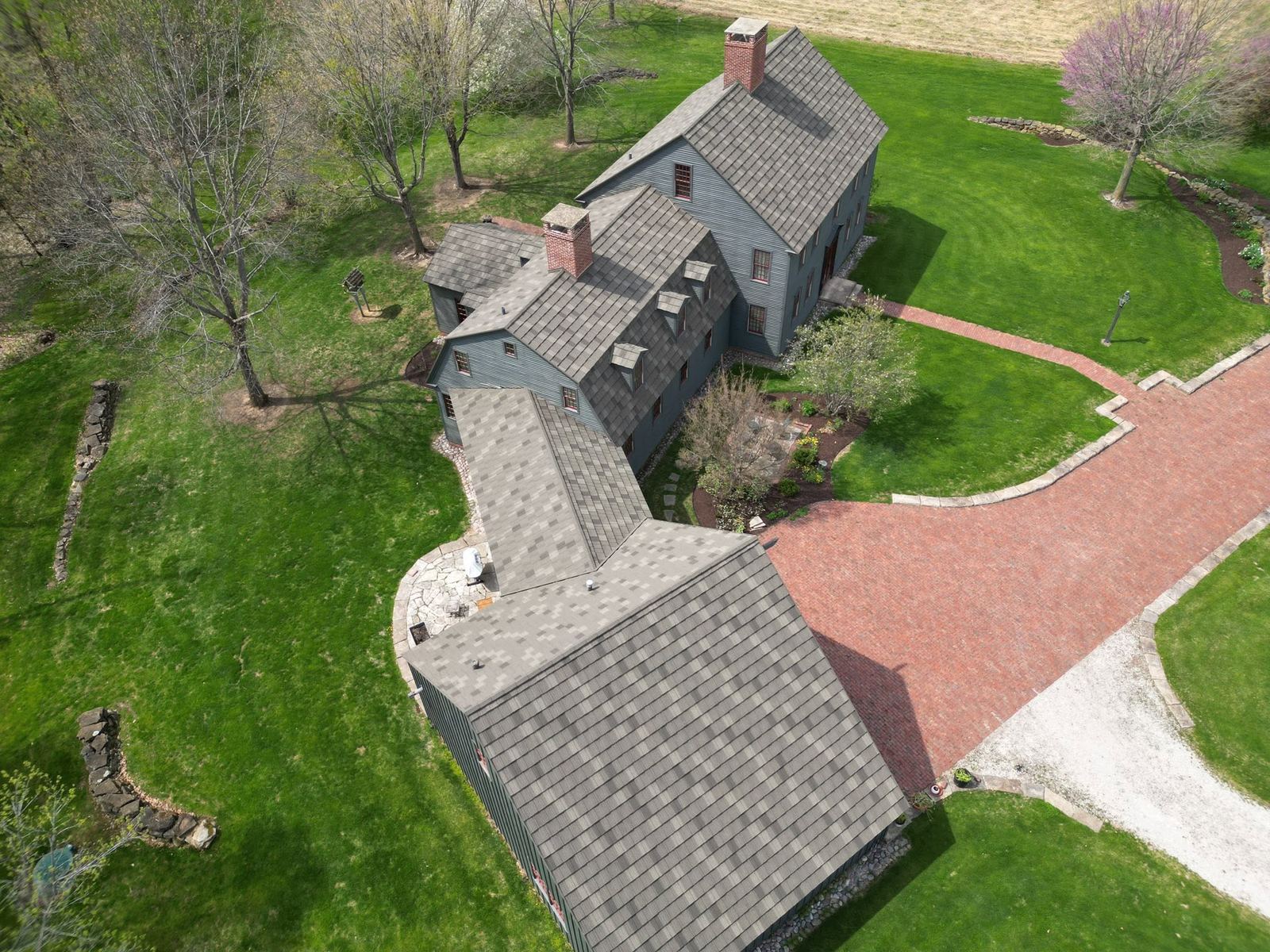 Residential shingle roof and driveway aerial view